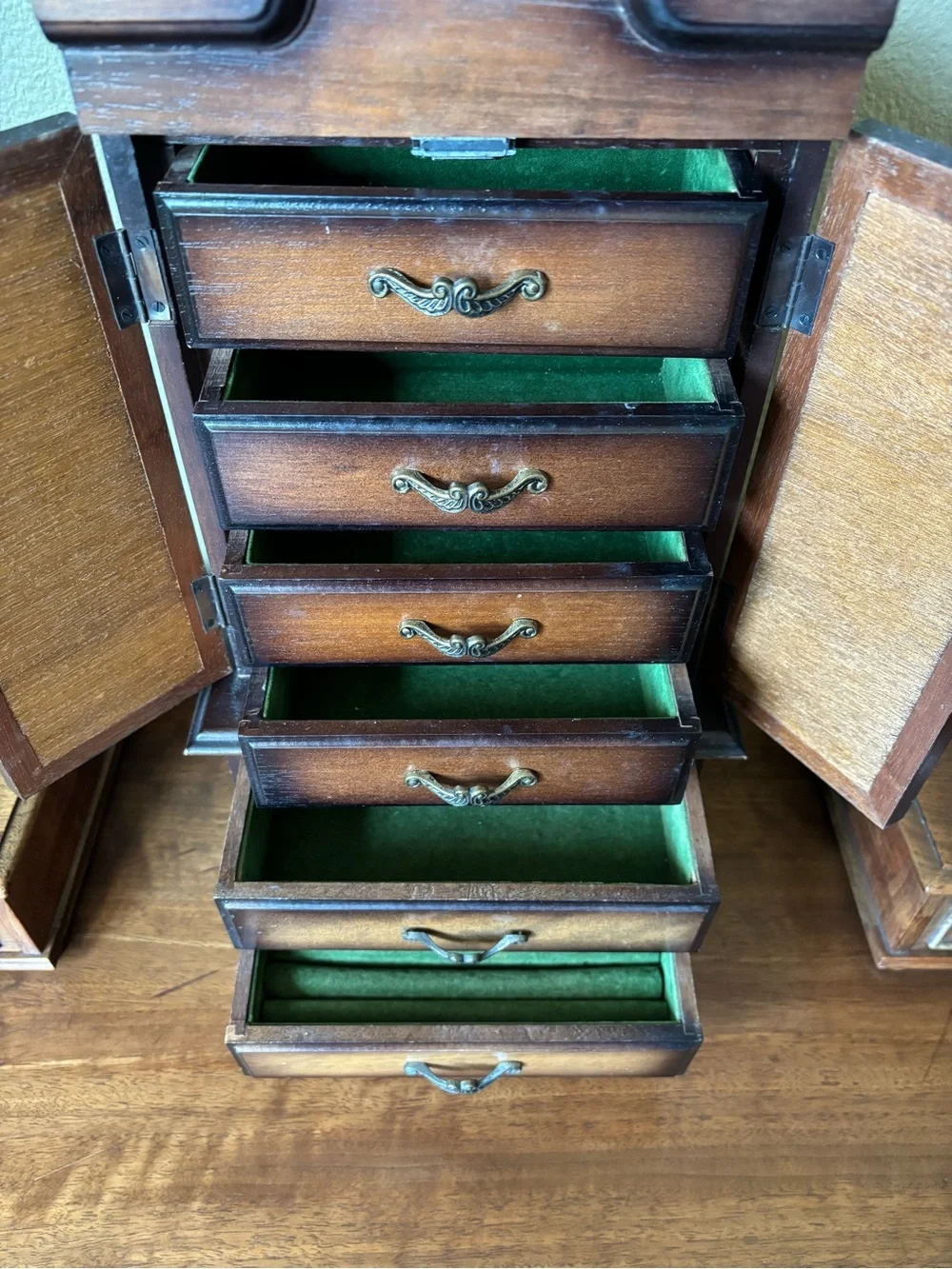 Antique wood jewelry box with drawers and metal hardware